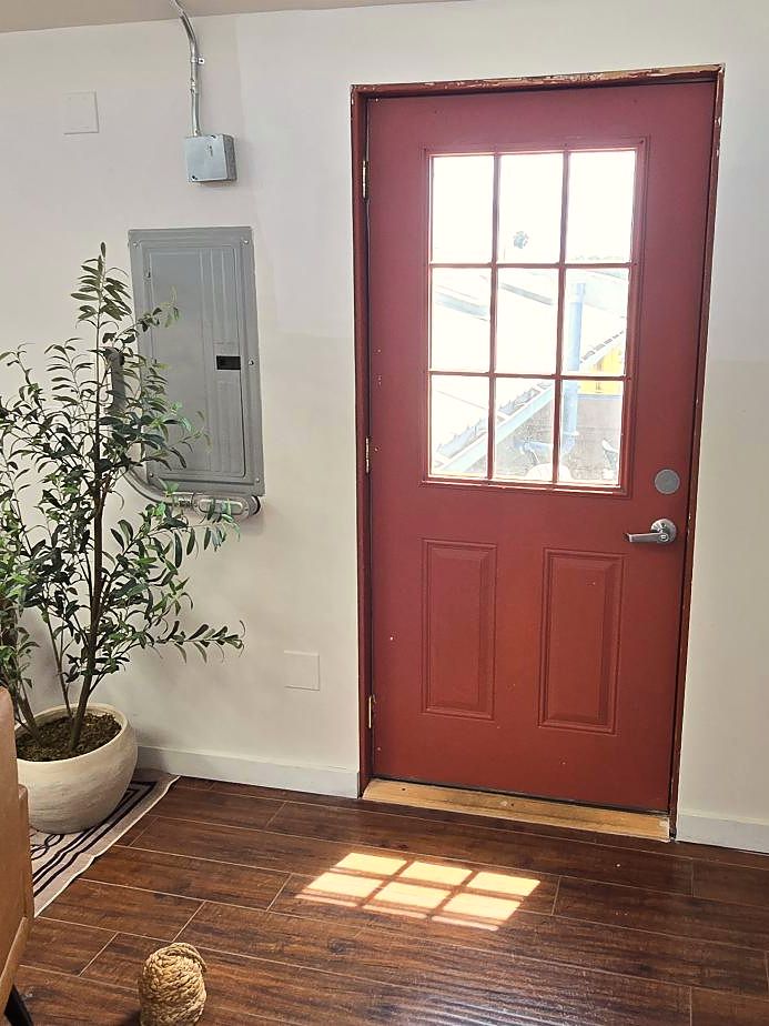 The red door, olive trees and cubbies in the lounge